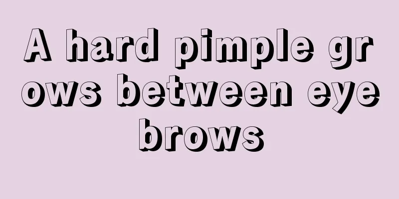 A hard pimple grows between eyebrows