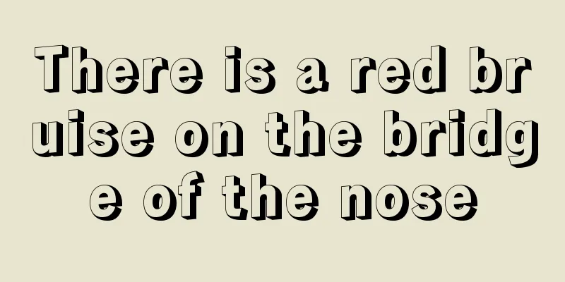There is a red bruise on the bridge of the nose