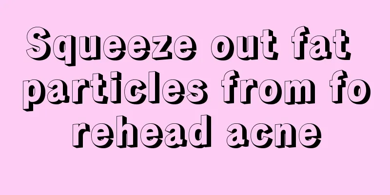 Squeeze out fat particles from forehead acne