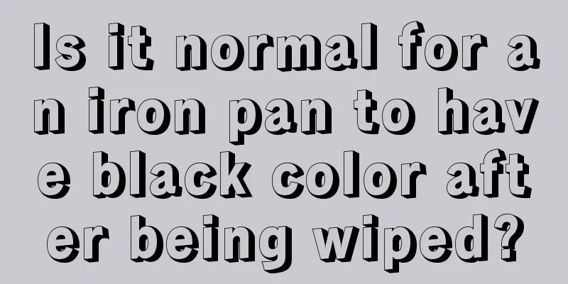 Is it normal for an iron pan to have black color after being wiped?