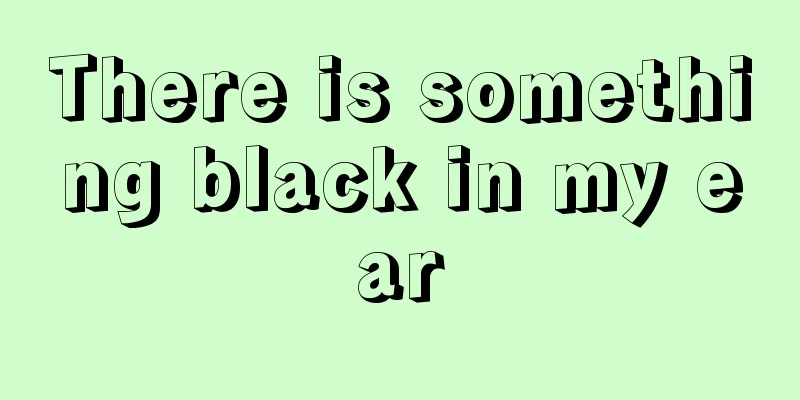 There is something black in my ear