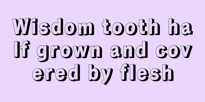 Wisdom tooth half grown and covered by flesh