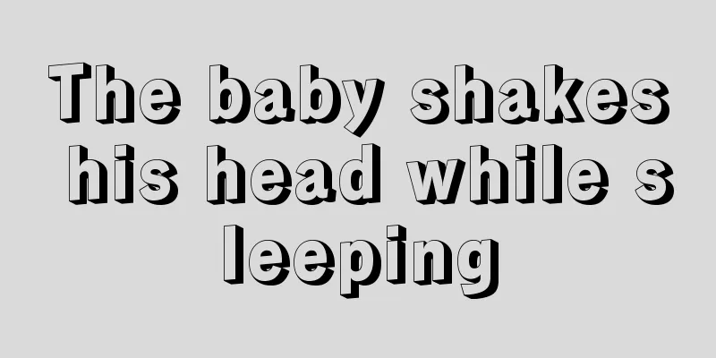 The baby shakes his head while sleeping