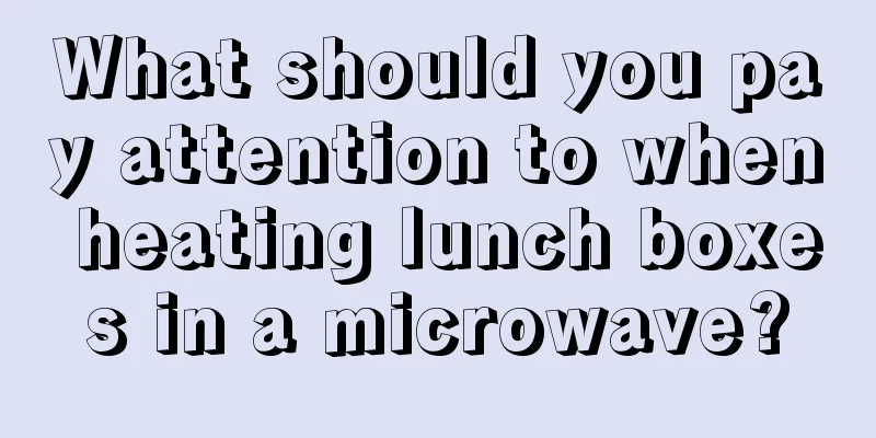 What should you pay attention to when heating lunch boxes in a microwave?