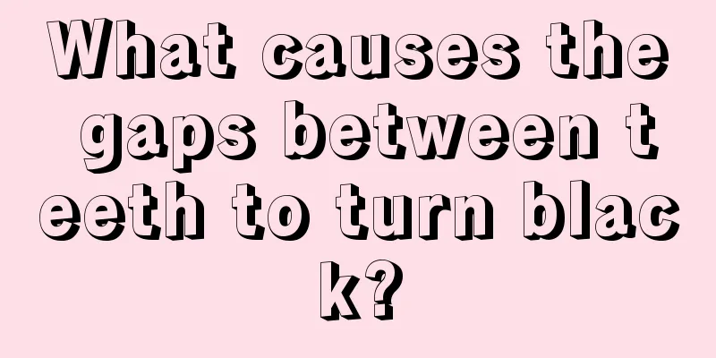 What causes the gaps between teeth to turn black?