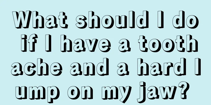 What should I do if I have a toothache and a hard lump on my jaw? 
