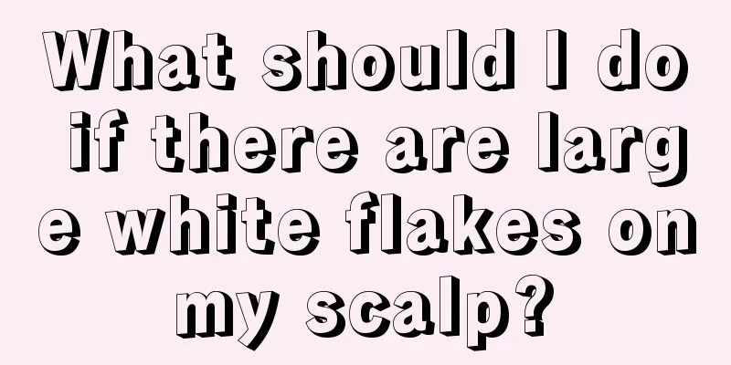 What should I do if there are large white flakes on my scalp? 