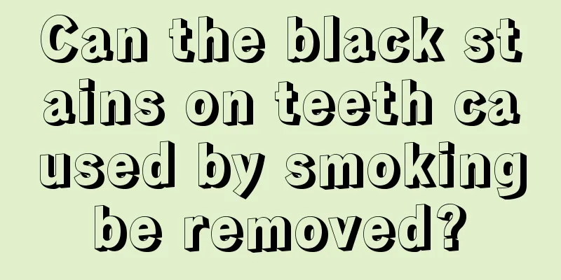 Can the black stains on teeth caused by smoking be removed? 
