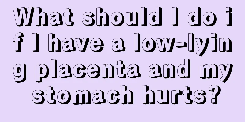 What should I do if I have a low-lying placenta and my stomach hurts?